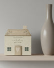Beige wooden house decor from Widdop & Co, featuring the phrase 