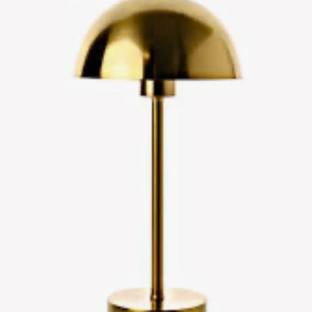 Gold Dome Lamp by Widdop & Co features a sleek, rounded design with a gold finish, ideal for modern interior lighting.