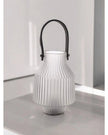 White frosted LED lantern by Widdop & Co with a soft glow, ideal for ambient lighting and decorative use.