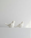 Set of two decorative bird ornaments by Wikholmform for home décor, featuring detailed craftsmanship and natural bird designs.