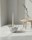 Grey ceramic flower candle holder by Wikholmform, designed for elegant home decor with a floral motif.