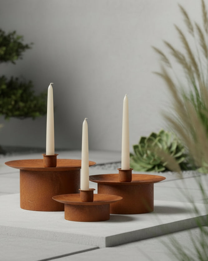Set of 3 large rusty metal dinner candlestick holders by Wikholmform, perfect for rustic home décor displays.