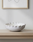 White ceramic bowl by Wikholmform, elegant home décor piece with smooth finish and minimalist design.