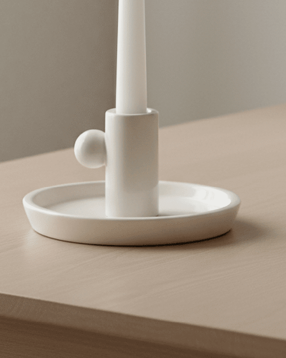 White ceramic candlestick holder by Wikholmform, elegant home decor accessory with a smooth finish and classic design.