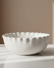 White ceramic scalloped serving bowl by Wikholmform, ideal for home décor and stylish table settings.