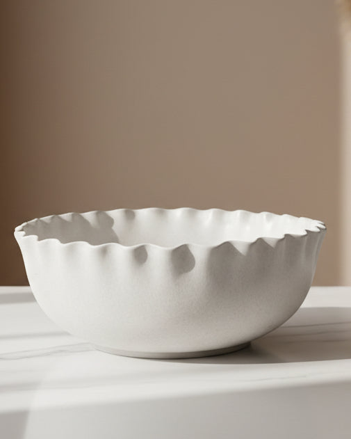 White ceramic scalloped serving bowl by Wikholmform, ideal for home décor and elegant table presentation.