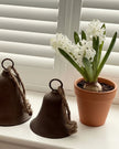 Rustic brass-colored bell from Wikholmform, used as a home décor accent with a vintage, handcrafted appearance.