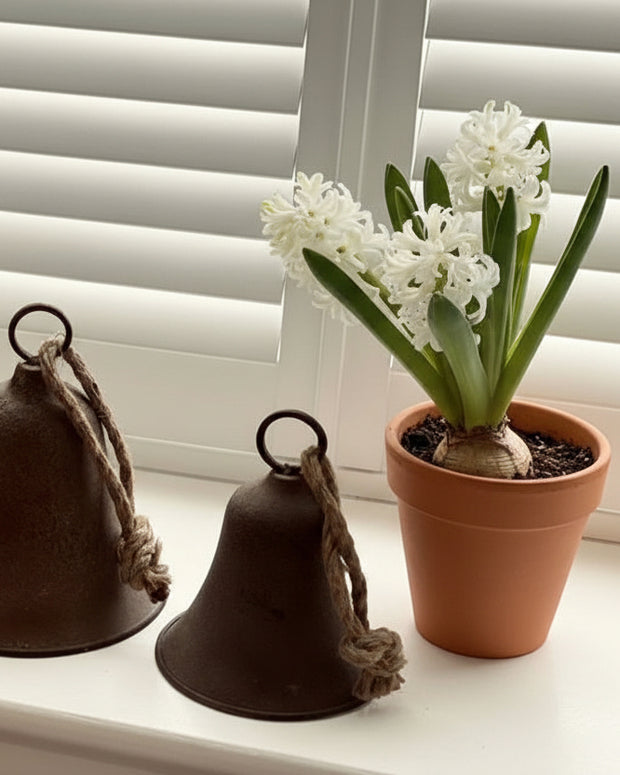 Rustic brass-colored bell from Wikholmform, used as a home décor accent with a vintage, handcrafted appearance.