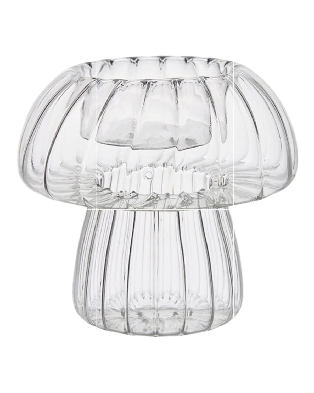 Spring ribbed glass mushroom tealight candle holders by Wikholmform, featuring a delicate mushroom shape and textured glass design.