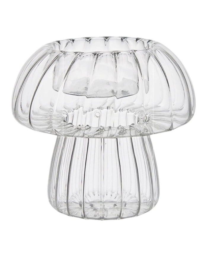 Spring ribbed glass mushroom tealight candle holders by Wikholmform, featuring a delicate mushroom shape and textured glass design.