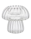 Spring ribbed glass mushroom tealight candle holders by Wikholmform, featuring a delicate mushroom shape and textured glass design.