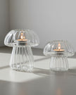 Spring ribbed glass mushroom tealight candle holders by Wikholmform, featuring a delicate mushroom design for cozy ambiance.