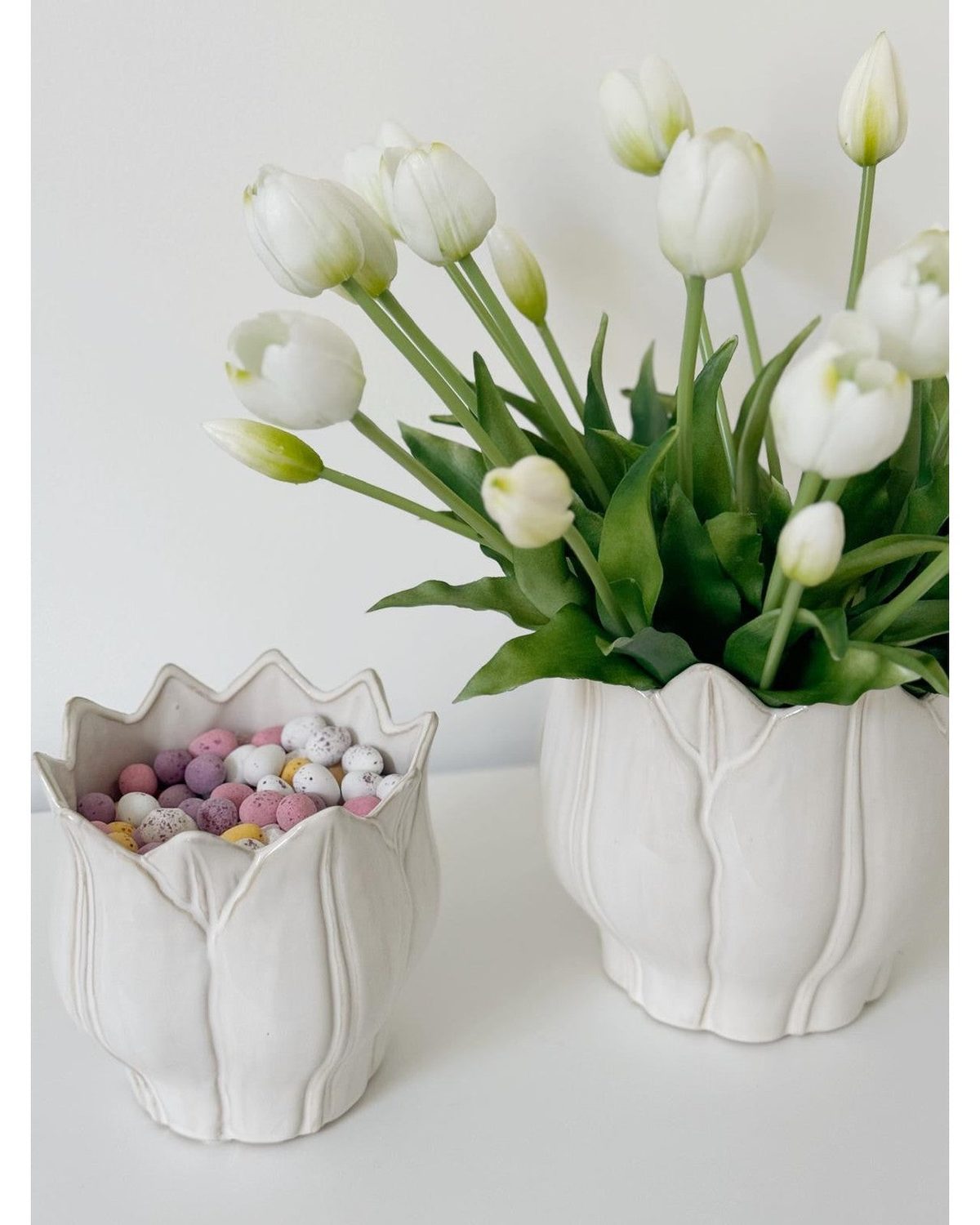 White ceramic Leslie Tulip Pot by Wikholmform, perfect for spring floral arrangements or decorative plant display.