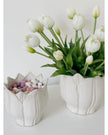 White ceramic Leslie Tulip Pot by Wikholmform, perfect for spring floral arrangements or decorative plant display.