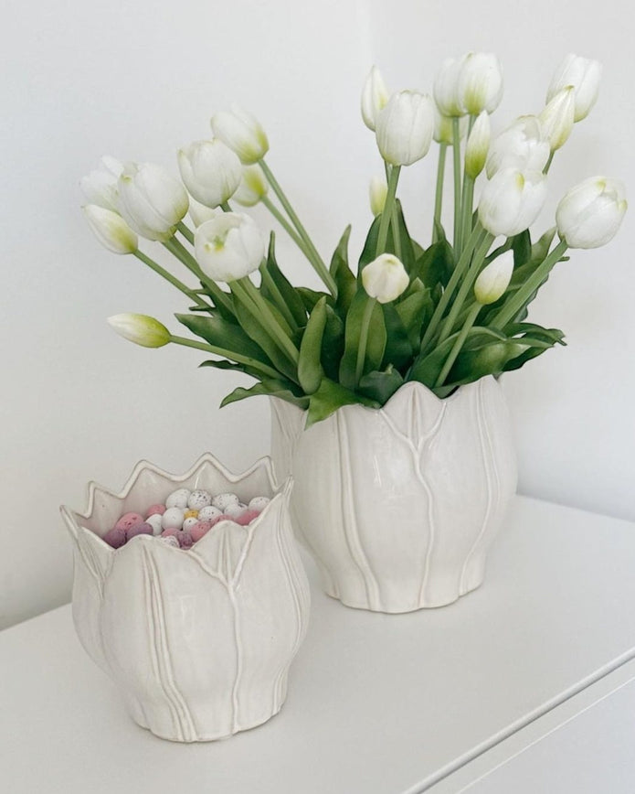 White ceramic Leslie Tulip Pot by Wikholmform, perfect for spring floral arrangements, showcasing a smooth, elegant tulip-shaped design.
