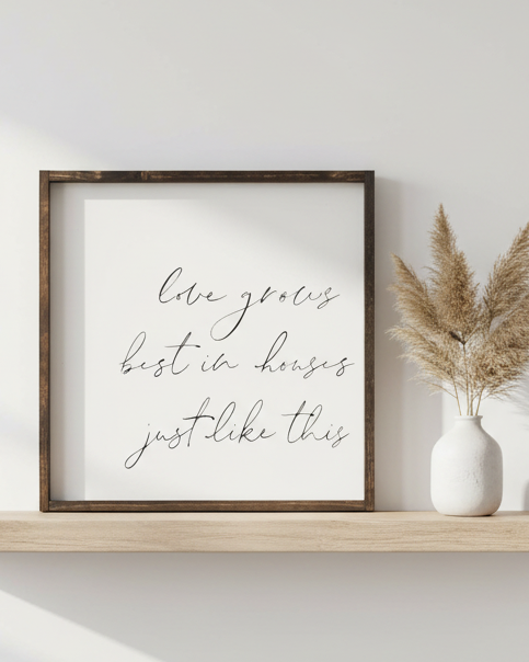 Large white framed home décor sign by Williamraedesigns with the quote "Love Grows Best In Houses" displayed on the sign.