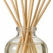 Close-up of Winter Scent Medium Reed Diffuser from Heaven Scent Incense Ltd with decorative reeds in a clear glass bottle.