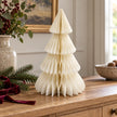 Winter White Paper Christmas Tree on an oak sideboard with festive greenery and burgundy ribbon