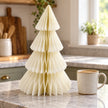Winter White Paper Christmas Tree beside a mug of coffee on a country kitchen counter