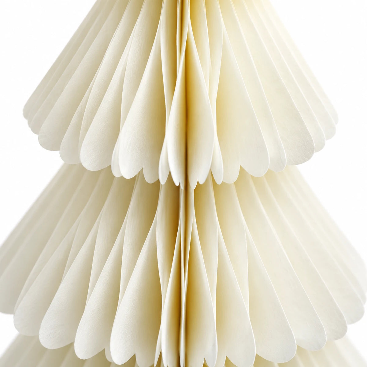 Close-up of the ivory paper folds and scalloped tier edges of the Winter White Paper Christmas Tree