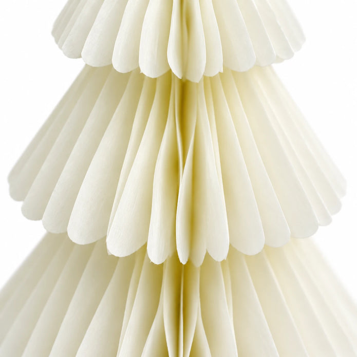 Close-up of the layered tiers and folded paper edges on a winter white paper Christmas tree.