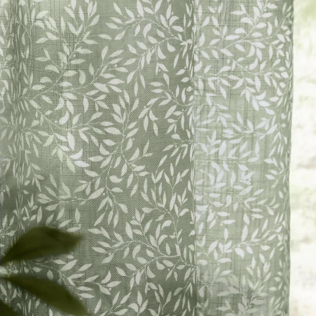 Green woven sheer voile curtain panel with yard leaf pattern, soft furnishings by Riva Home, 140cm wide and 250cm long.