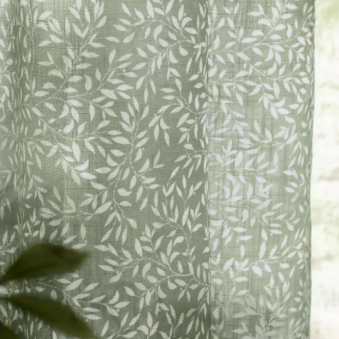 Green woven sheer voile curtain panel with yard leaf pattern, soft furnishings by Riva Home, 140cm wide and 250cm long.