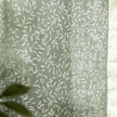 Green woven sheer voile curtain panel with yard leaf pattern, soft furnishings by Riva Home, 140cm wide and 250cm long.