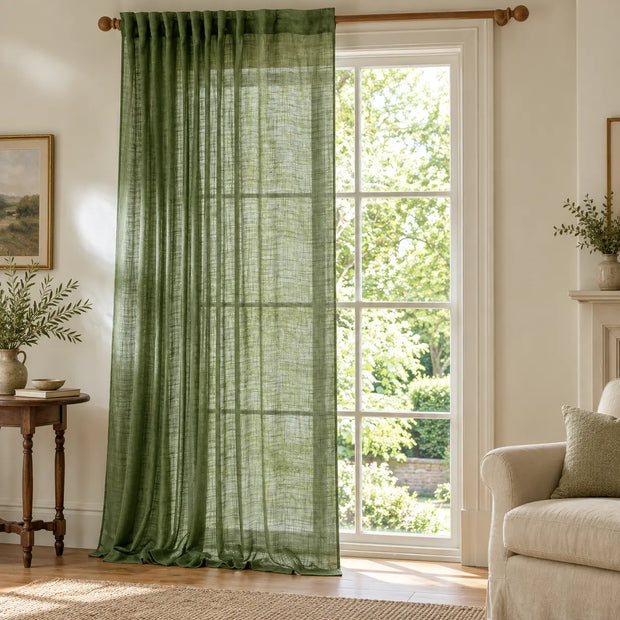 Yard olive green sheer voile curtain panel styled in a bright country living room