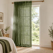 Olive green woven sheer voile curtain panel from Riva Home, styled in a bedroom setting, showcasing soft, elegant window coverage.