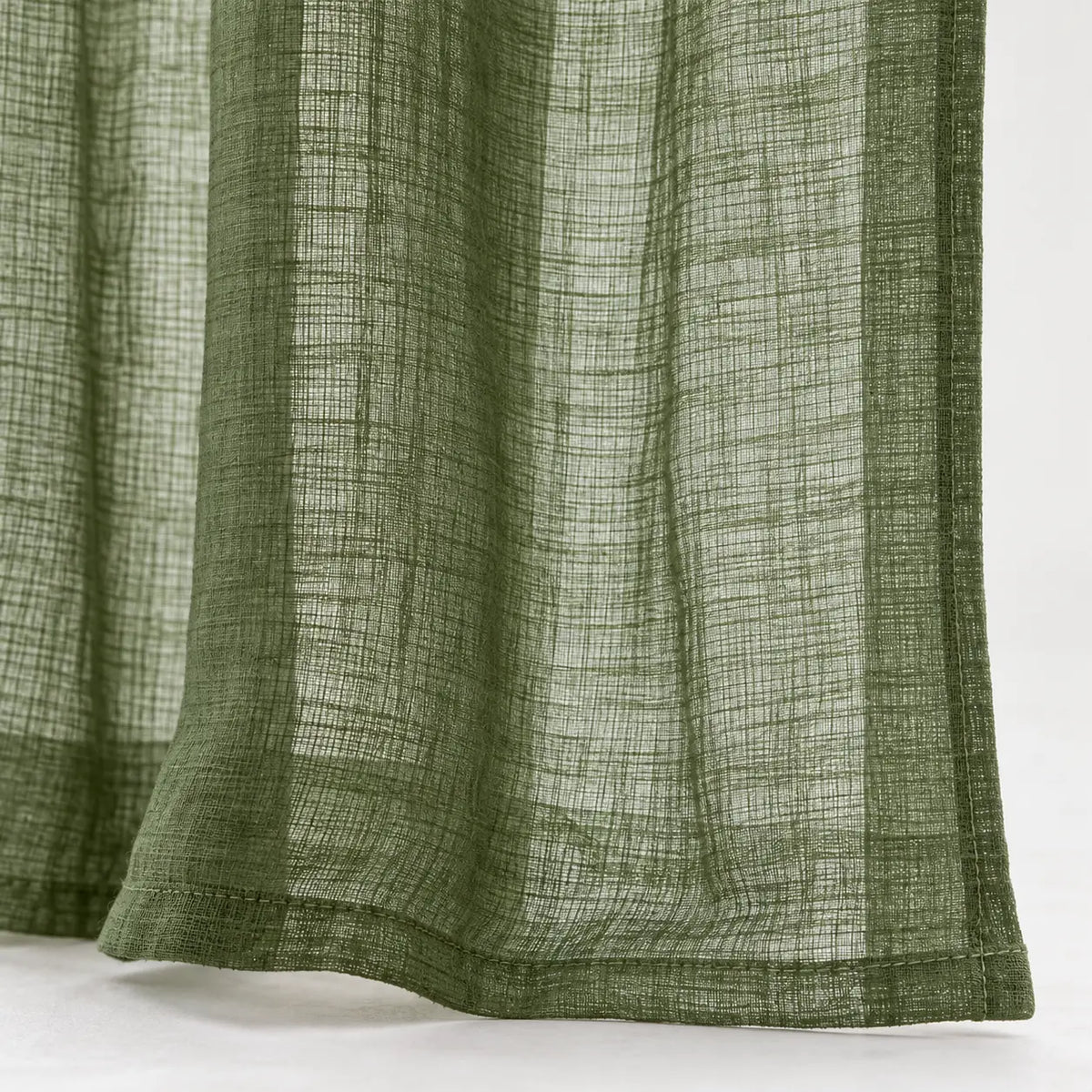 Olive green woven sheer voile curtain panel with hem detail, soft furnishings by Riva Home, ideal for elegant window decor.