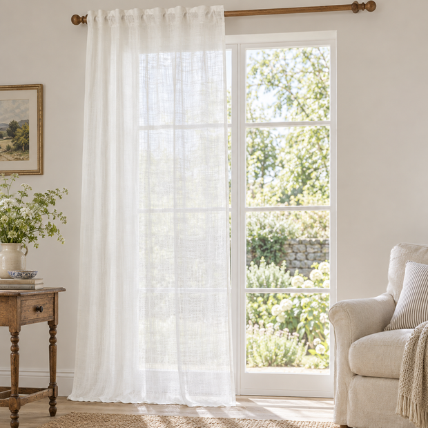 Yard white sheer voile curtain panel styled in a bright country living room