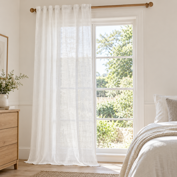 Yard white sheer voile curtain panel styled beside a country bedroom window