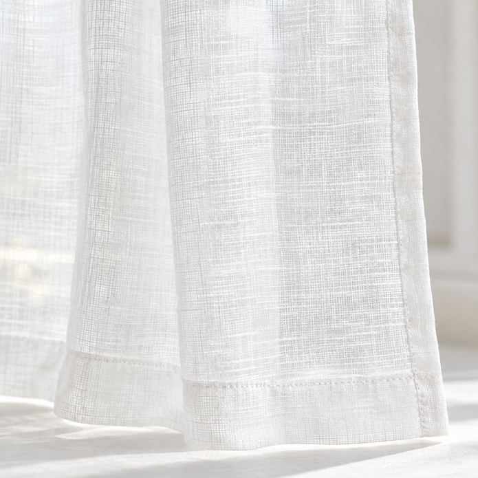 Yard white sheer voile curtain panel close-up of the fabric hem and edge