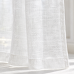 Yard white sheer voile curtain panel close-up of the fabric hem and edge